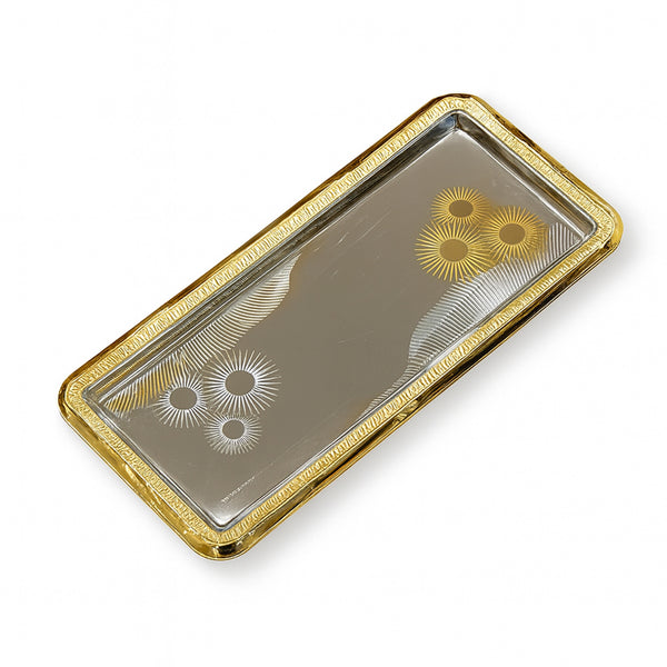 Decorative tray with gold rim and engraved patterns on a white background