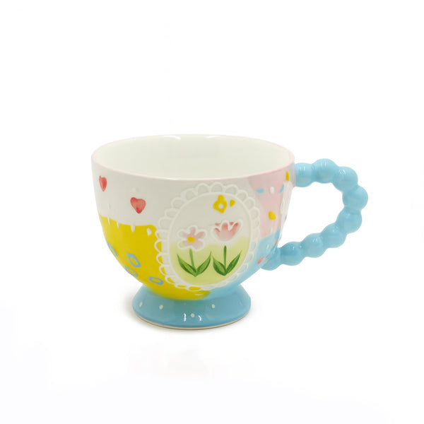 1516-14 Ceramic Mug – Floral Design with Blue Handle and Pedestal Base