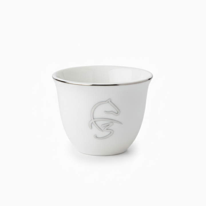 White ceramic cup with silver rim and logo on a white background