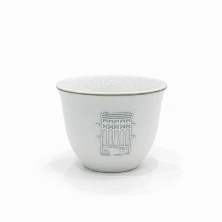 White ceramic bowl with decorative pattern on a white background