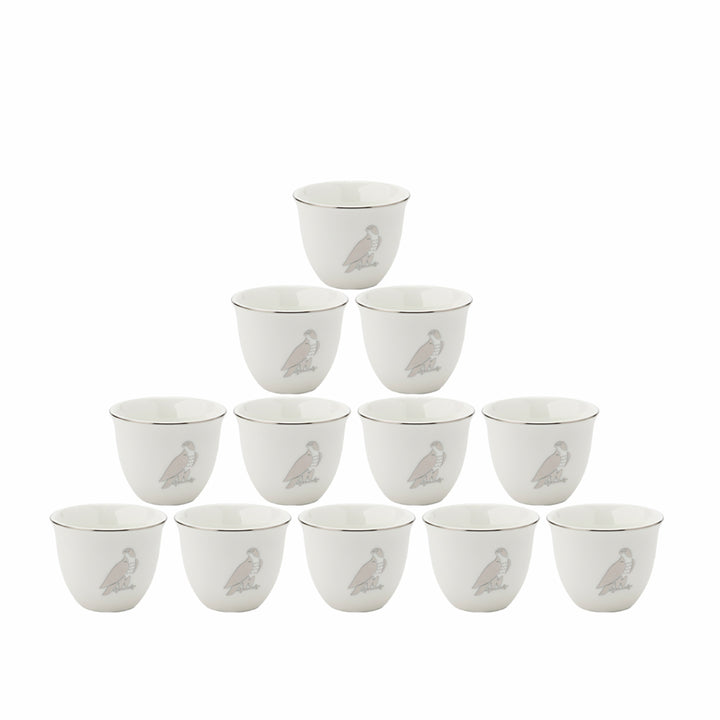 Set of 12 white cups with bird design on a white background