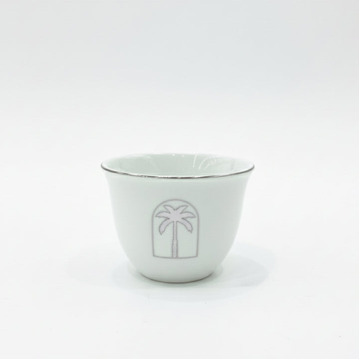 White ceramic bowl with a palm tree design on a white background