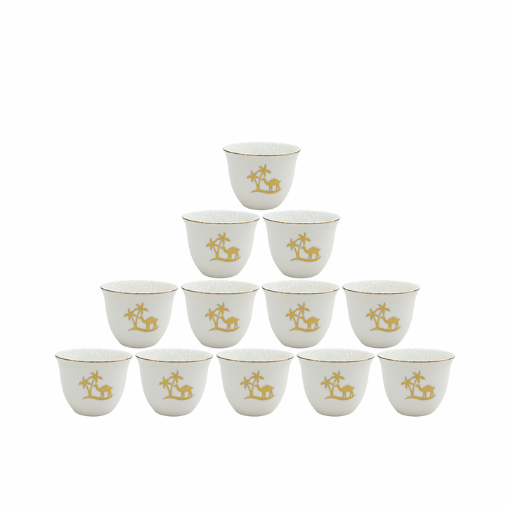 Set of twelve white cups with gold animal illustrations on a white background