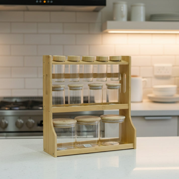 Wooden spice rack with glass jars on a kitchen counter
