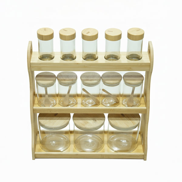 Wooden spice rack with glass jars and wooden lids on a white background