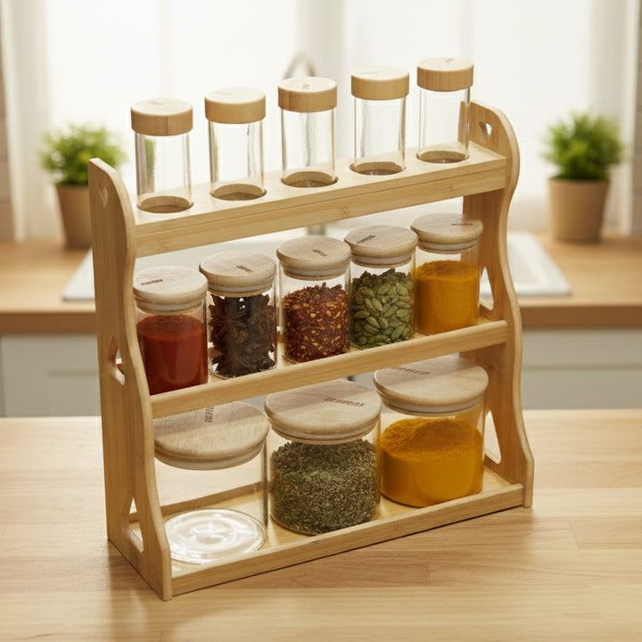 Wooden spice rack with glass jars containing various spices on a kitchen counter.