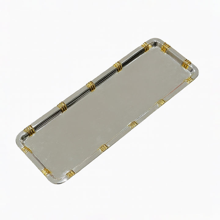Rectangular clear tray with gold and silver accents on a white background