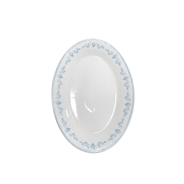 White oval plate with blue floral pattern on a white background