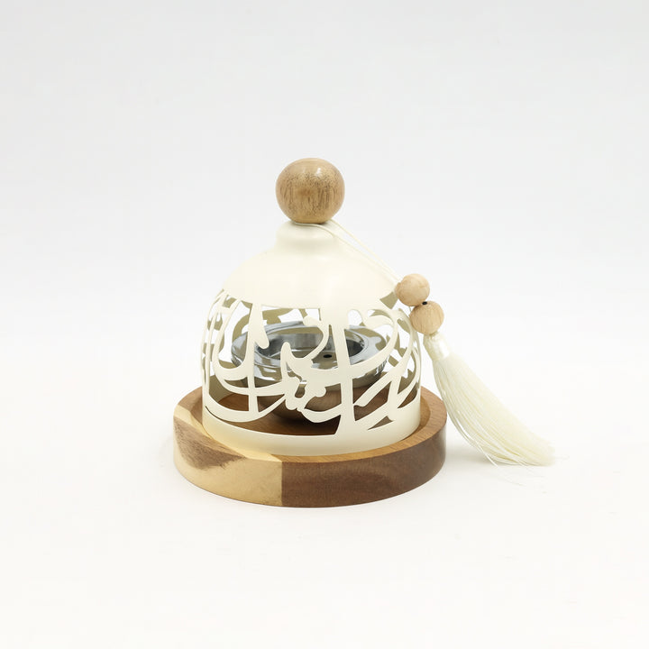 Decorative item with white lace-like design on a wooden base and top, on a white background