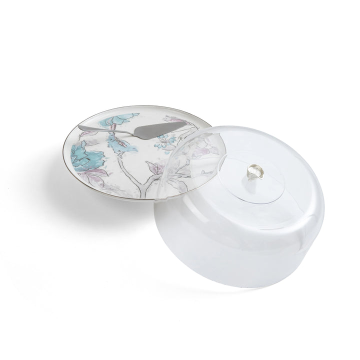 White ceramic dish with floral design on a white background