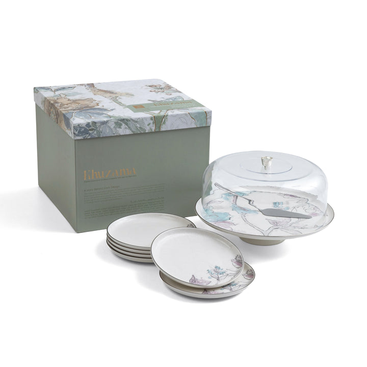 Set of ceramic plates with a decorative box on a white background