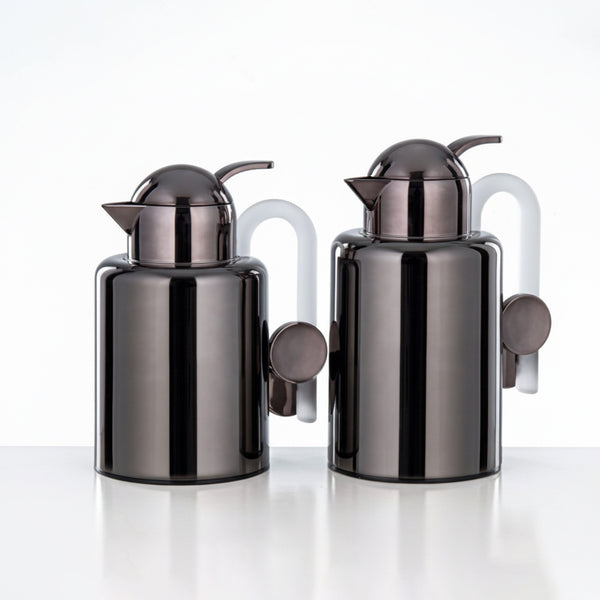 Two black and silver kitchen canisters on a white background