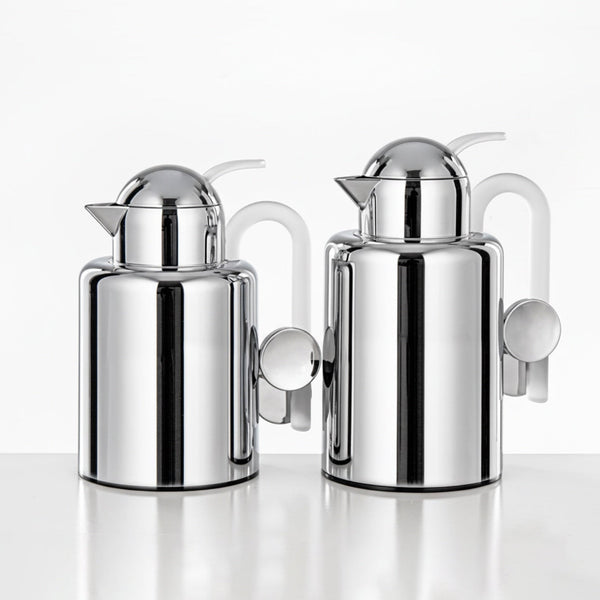 Two chrome-plated milk jugs on a white background