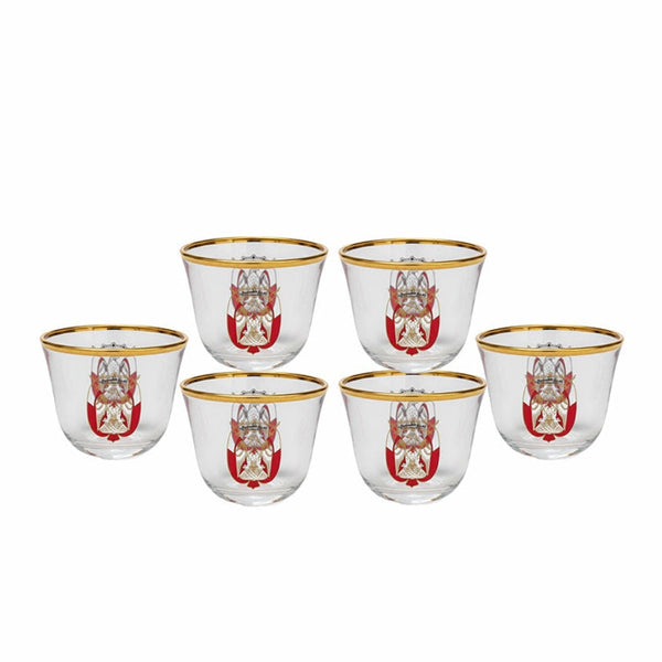 Set of six glass tumblers with gold rims and red and white designs on a white background