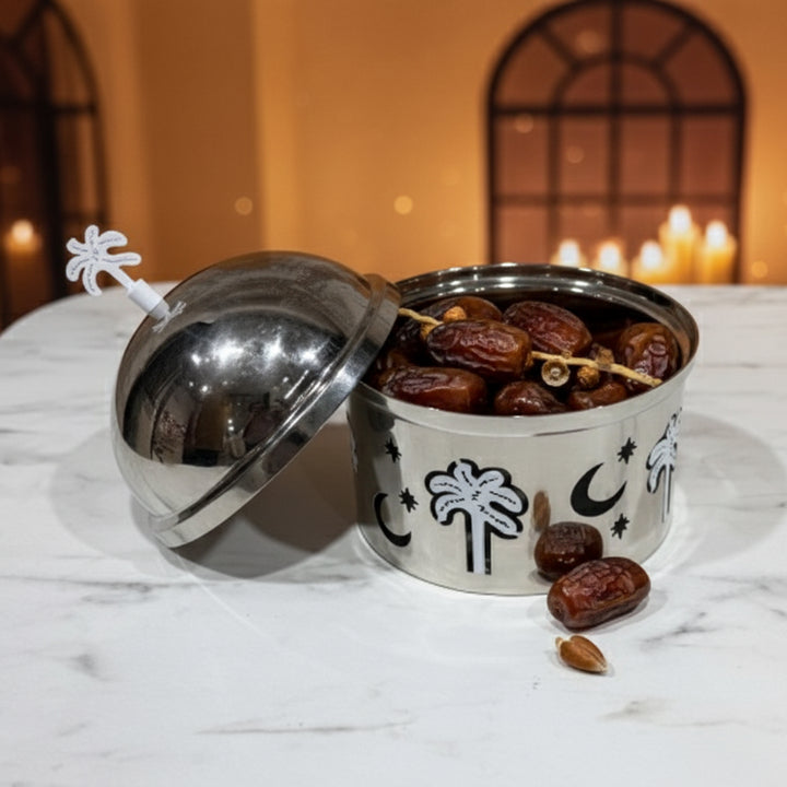 Metal container with dates on a marble surface with a warm background