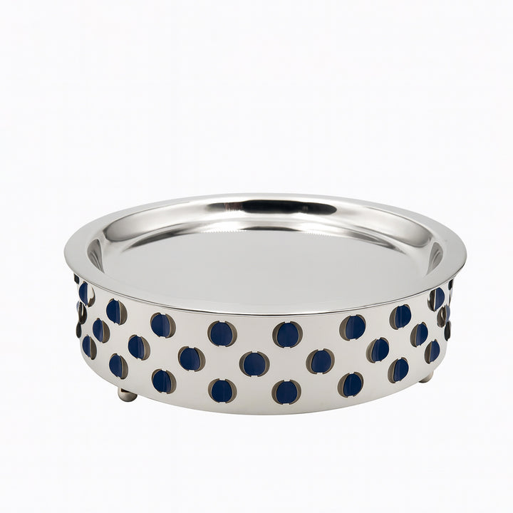 Silver bowl with blue circular patterns on a white background