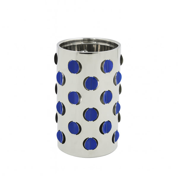 Silver cylindrical container with blue and black polka dot pattern on a white background