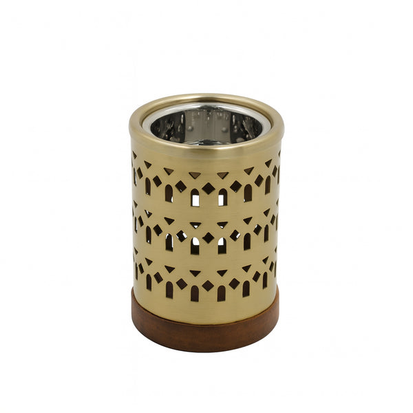 Decorative candle holder with intricate cut-out design on a white background