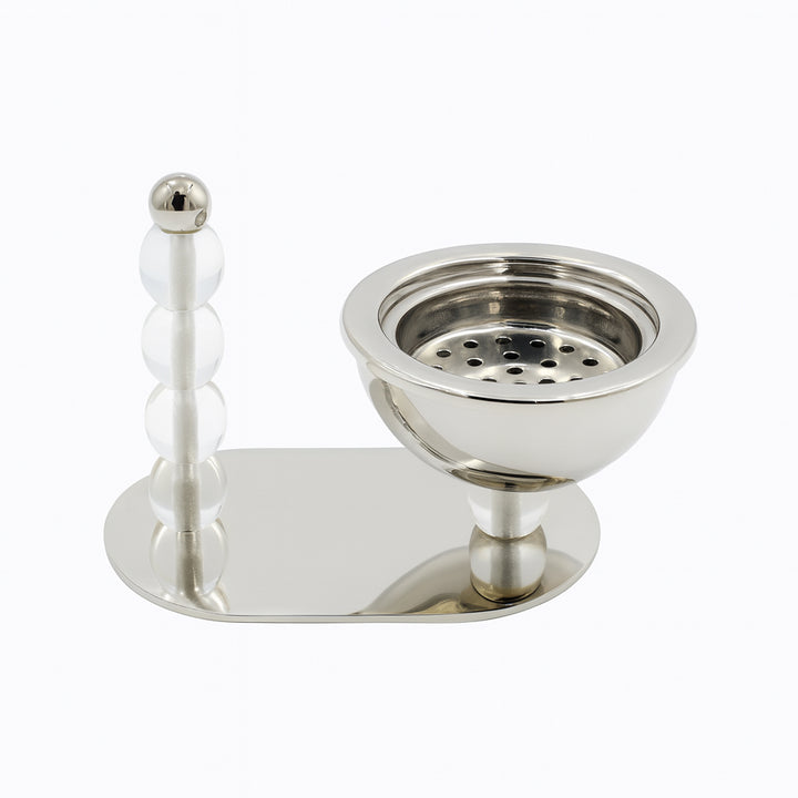Silver incense burner with a long, thin handle on a white background