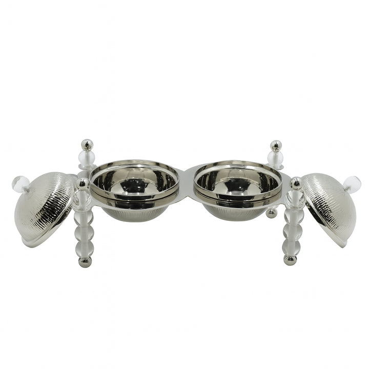 Silver pet feeding station with four bowls on a white background