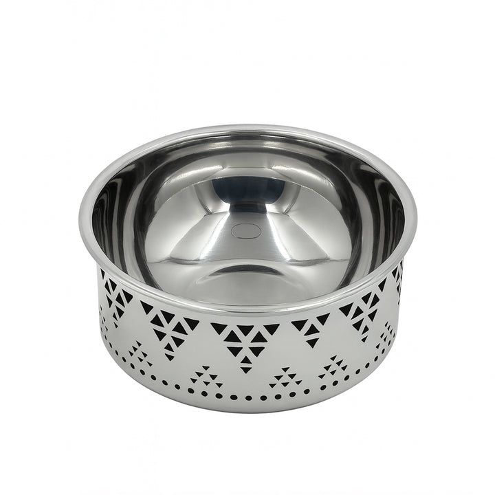 Stainless steel bowl with decorative cut-out design on a white background