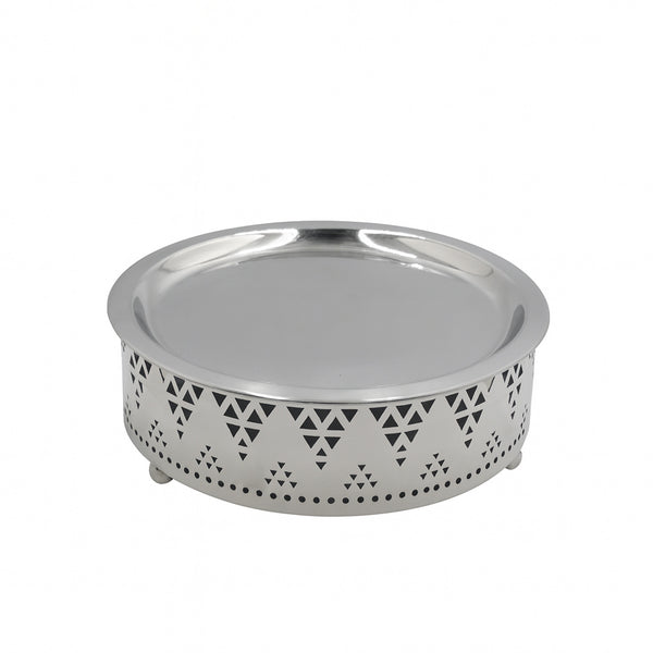 Silver metal bowl with decorative pattern on a white background