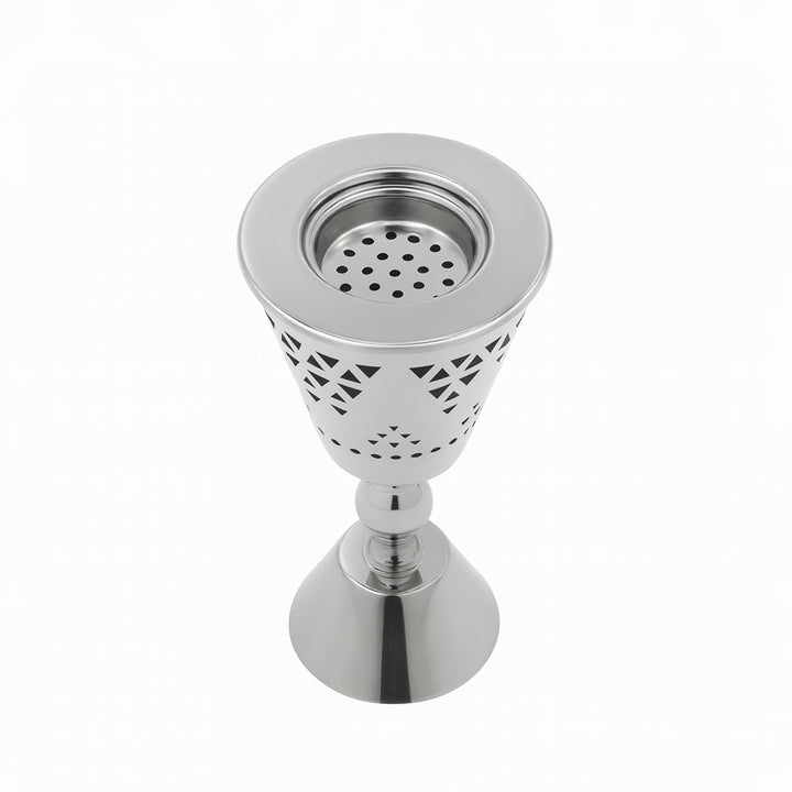 Metallic decorative object with a perforated design on a white background