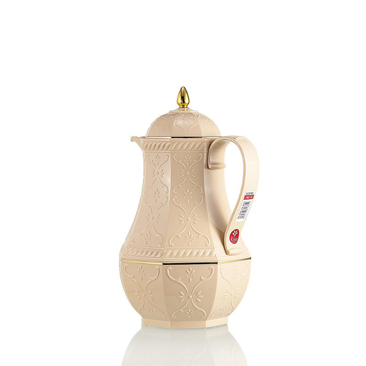 Beige embossed teapot with a gold lid on a white background