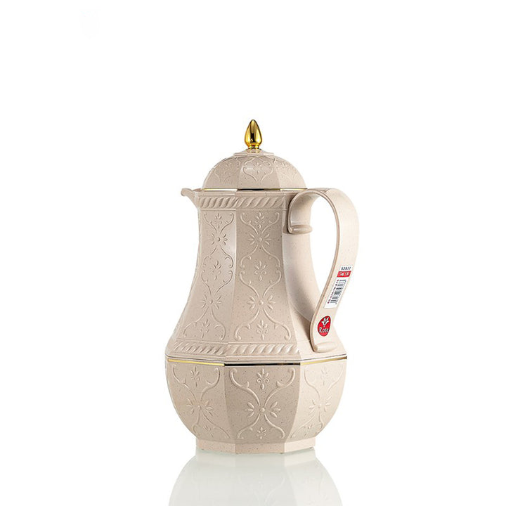 Beige ceramic coffee pot with decorative patterns on a white background
