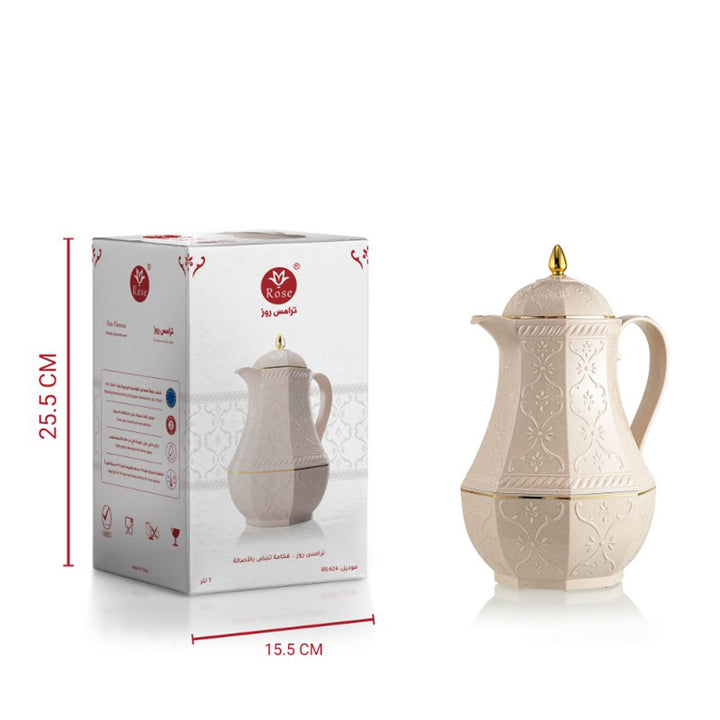 Beige ceramic coffee pot with gold accents next to its packaging box on a white background