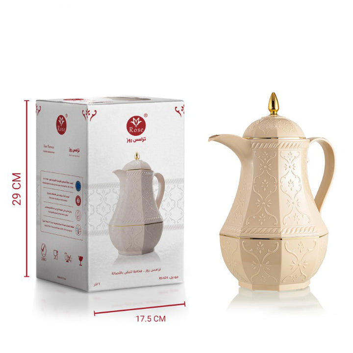 Beige ceramic coffee pot with gold accents next to its packaging box on a white background