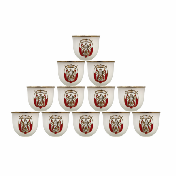 Set of twelve small cups with a red and white design on a white background