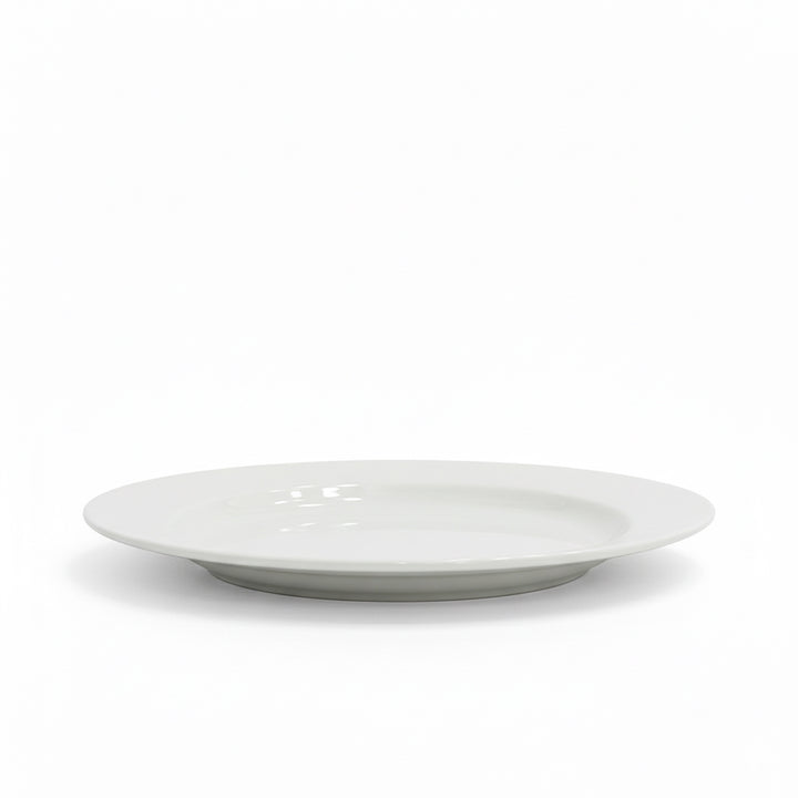 White ceramic plate on a white background