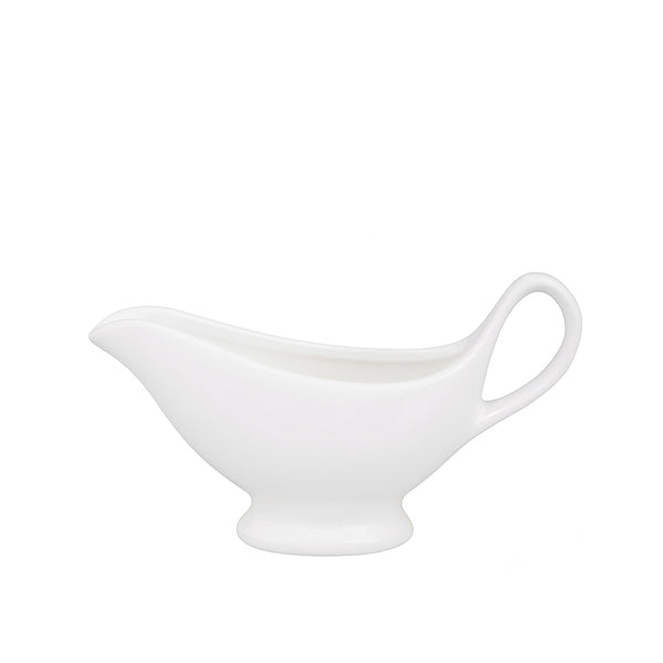 White ceramic gravy boat on a white background