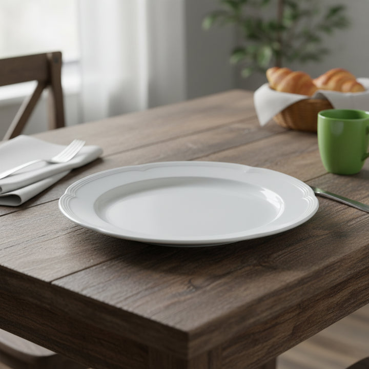 White plate on a wooden table with a green mug and bread basket in the background