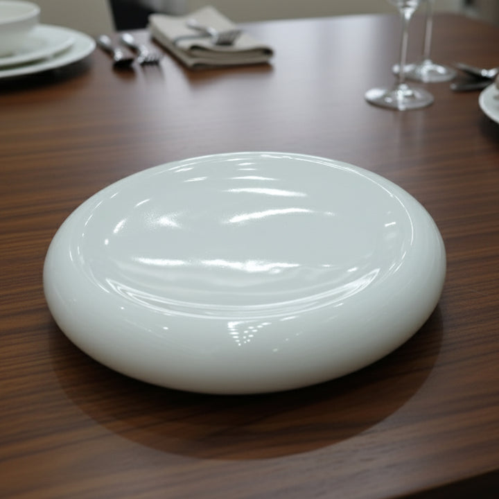White ceramic plate on a wooden table