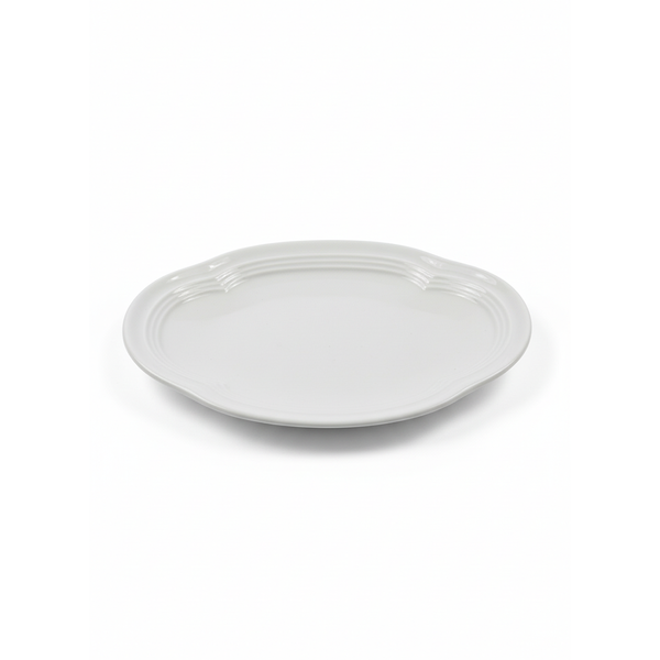 White ceramic plate on a white background