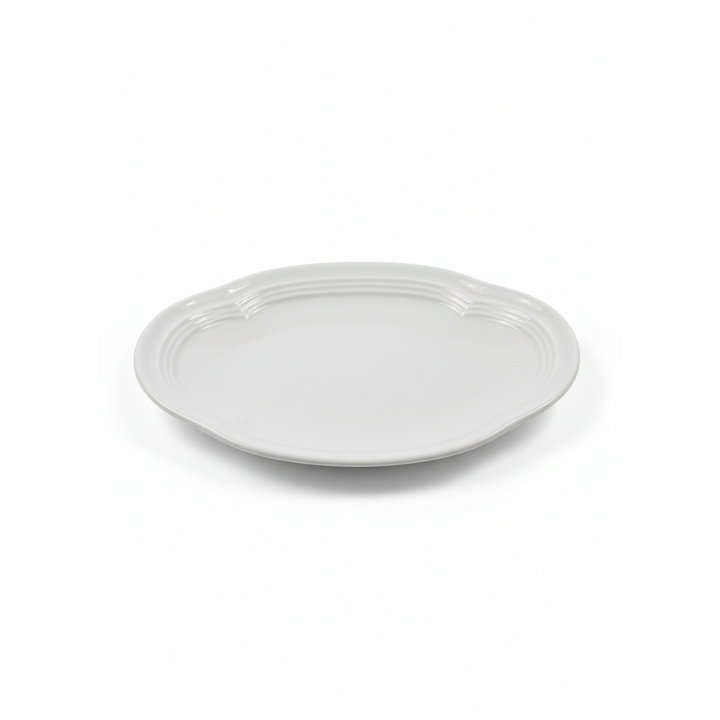 White ceramic plate on a white background