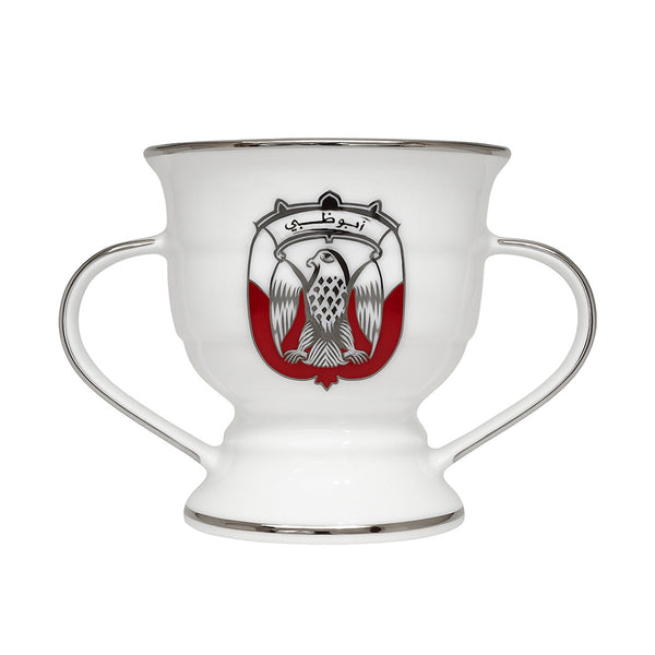 White cup with handles featuring a central emblem on a white background