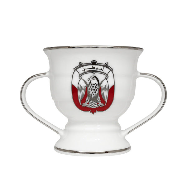 White cup with handles featuring a red and black emblem on a white background