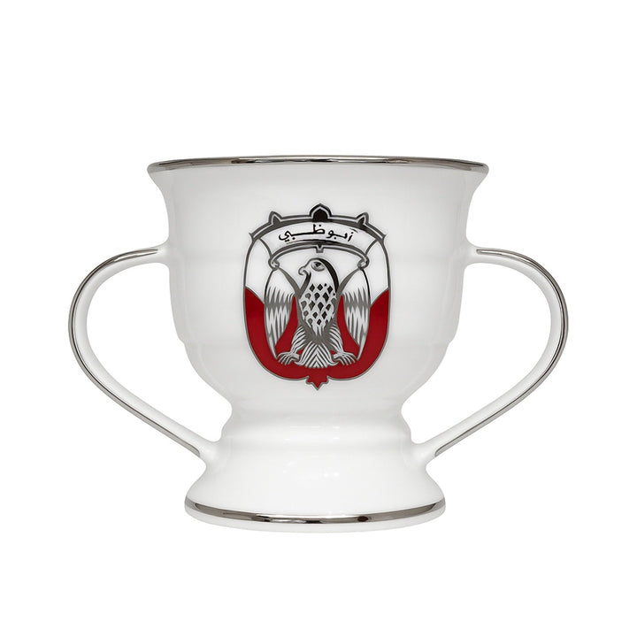 White cup with handles featuring a red and black emblem on a white background