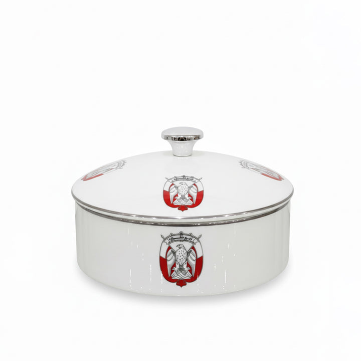 White ceramic dish with red and gold emblem on a white background