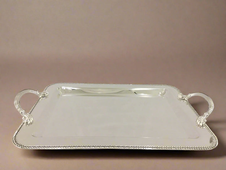 A rectangular silver metal serving tray with handles.
