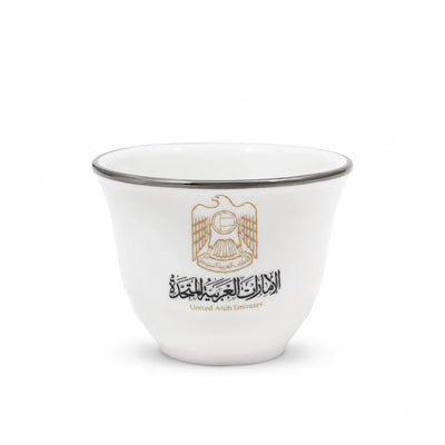 Elegant 12-Piece White Cawa Cup Set With A Refined Silver Rim And UAE Logo Design, Perfect For Serving Arabic Coffee During Gatherings And Special Occasions At Siddiq Gifts.