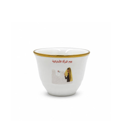 Elegant Twelve Piece White Ceramic Cawa Cup Set Featuring An Emirati Women’s Day Arabic Design And Refined Gold Rim, Ideal For Serving Arabic Coffee During Celebrations And Special Occasions At Siddiq Gifts.