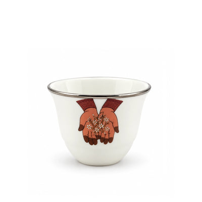 Elegant Twelve Piece White Ceramic Cawa Cup Set Featuring A Beautiful Flower In Hand Design And Refined Silver Rim, Ideal For Serving Arabic Coffee During Gatherings And Special Occasions At Siddiq Gifts.