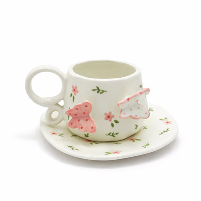 Ceramic cup and saucer set with pink floral design and dual 3D butterfly detail for tea and coffee serving – Siddiq Gifts Mussafah Abu Dhabi