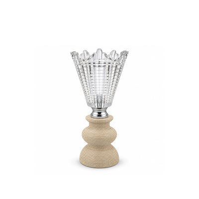 A decorative table lamp featuring a clear, faceted glass shade with a scalloped rim and a textured, rope-wrapped beige base on a white background.