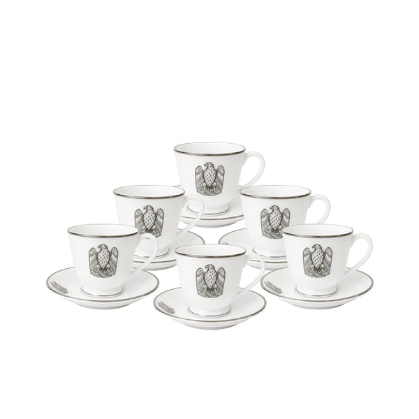 Set of six white espresso cups and saucers with black emblem on a white background
