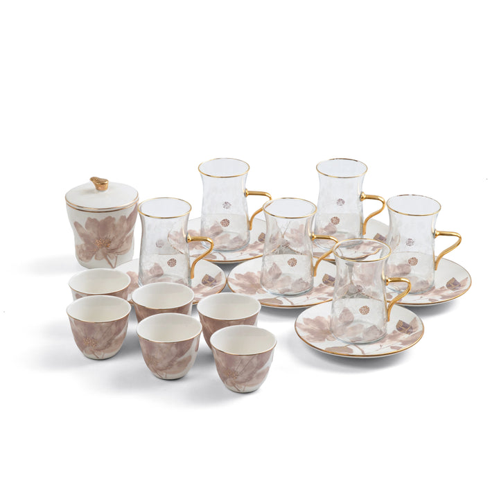 Ceramic tea set with floral patterns and gold accents on a white background
